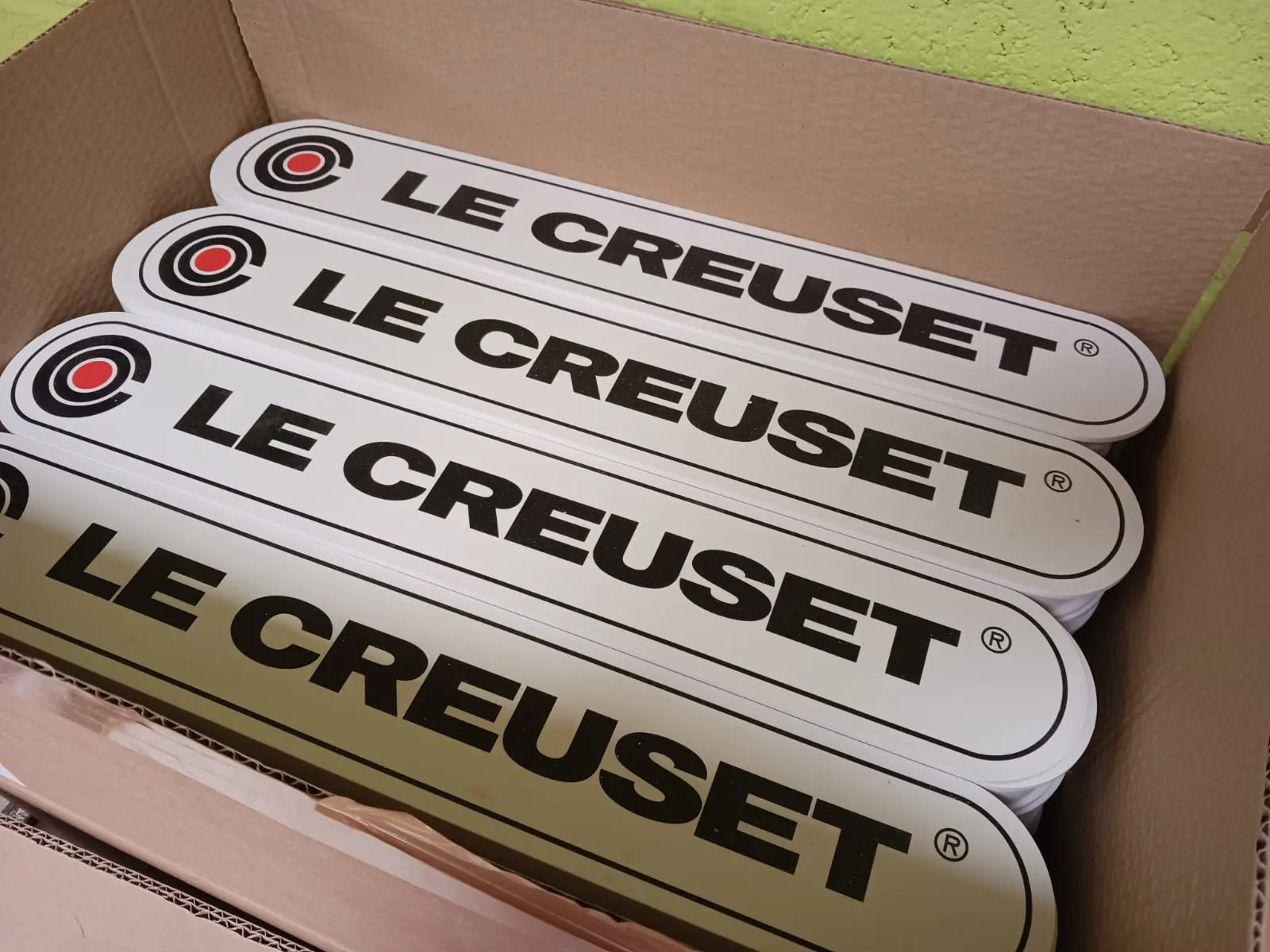 Le Creuset branded header components prepared for the display units